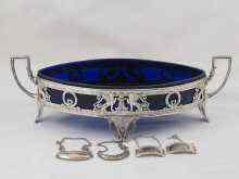 Appraisal: A silver plated navette shaped centrepiece with blue glass liner