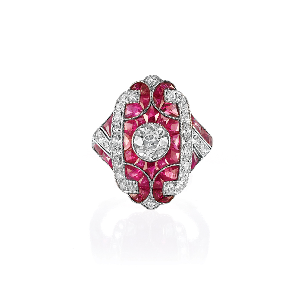 Appraisal: Platinum Diamond and Ruby Ring The modified rectangular plaque centering