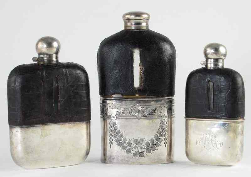 Appraisal: Three Vintage Silver and Leather Flaskstwo with silverplate and leather