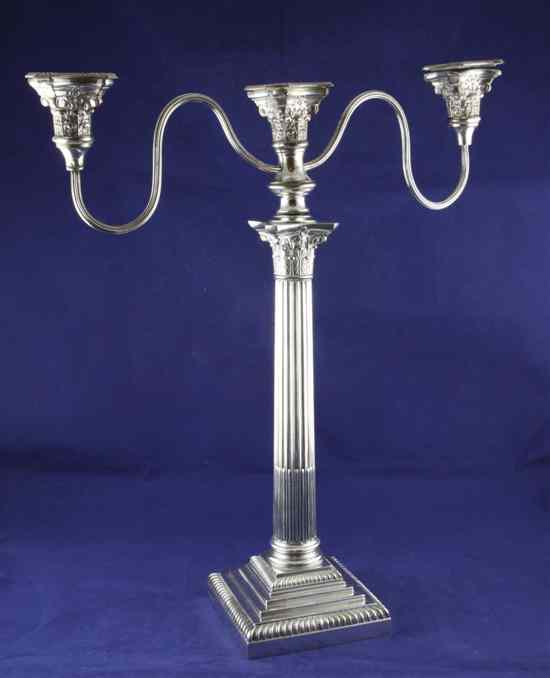 Appraisal: An Edwardian silver corinthian column candelabrum with silver plated branches