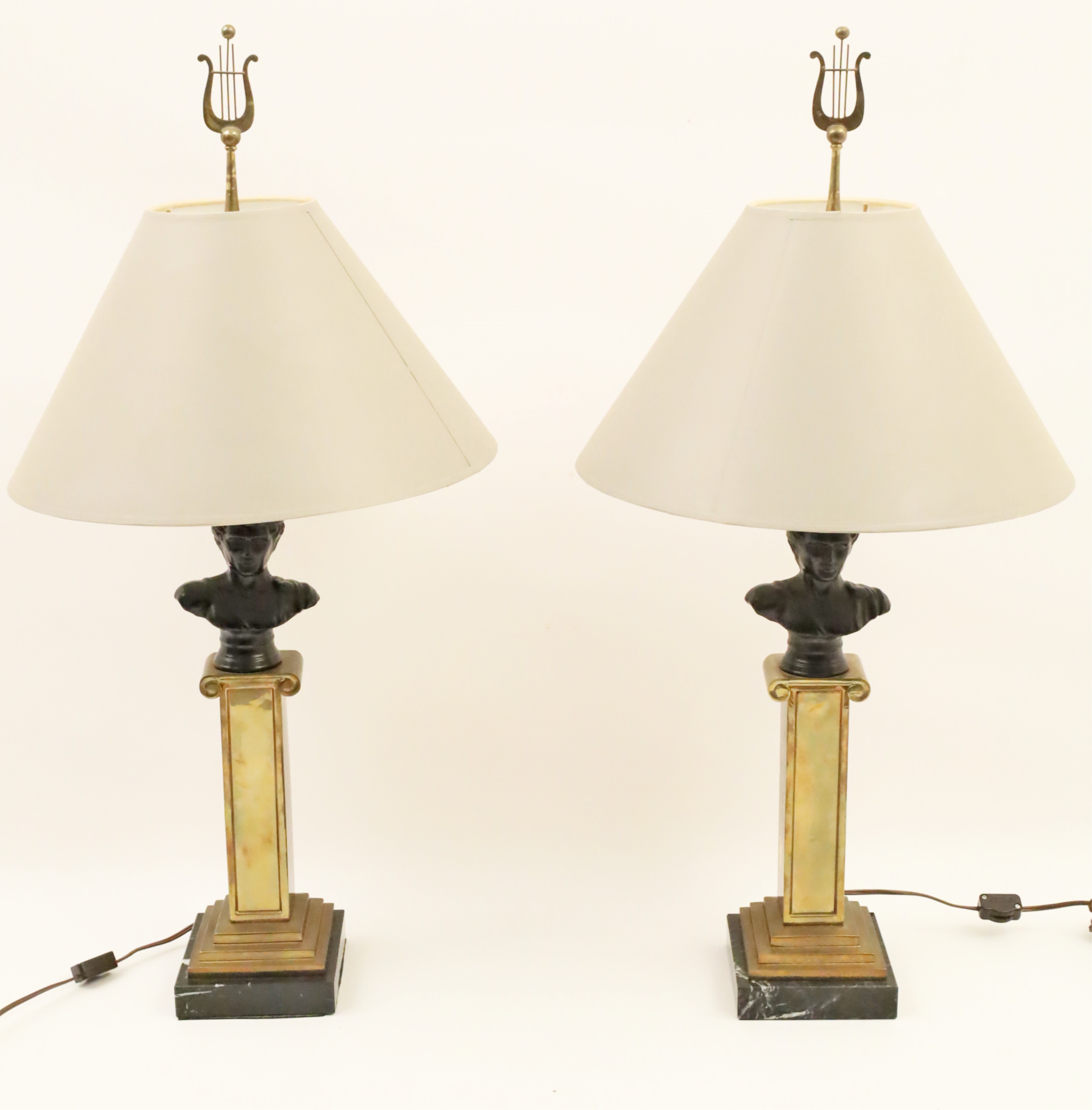 Appraisal: PAIR OF PATINATED BRONZE BUSTS ON PEDESTALS MOUNTED AS LAMPS