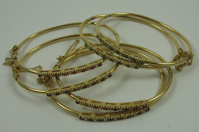 Appraisal: THREE PAIRS OF DIAMOND AND COLOR GEMSTONE BANGLES all K