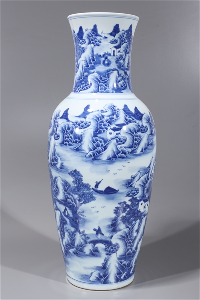 Appraisal: Tall Chinese blue and white porcelain vase with landscape designs