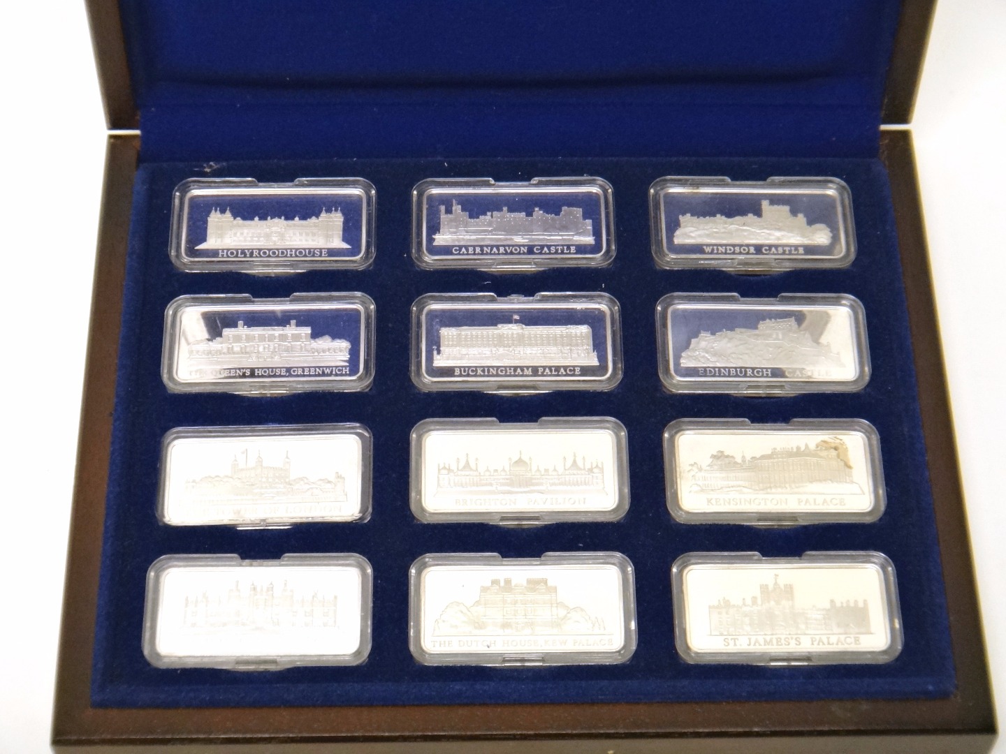 Appraisal: A set of twelve silver rectangular ingots commemorating royal palaces