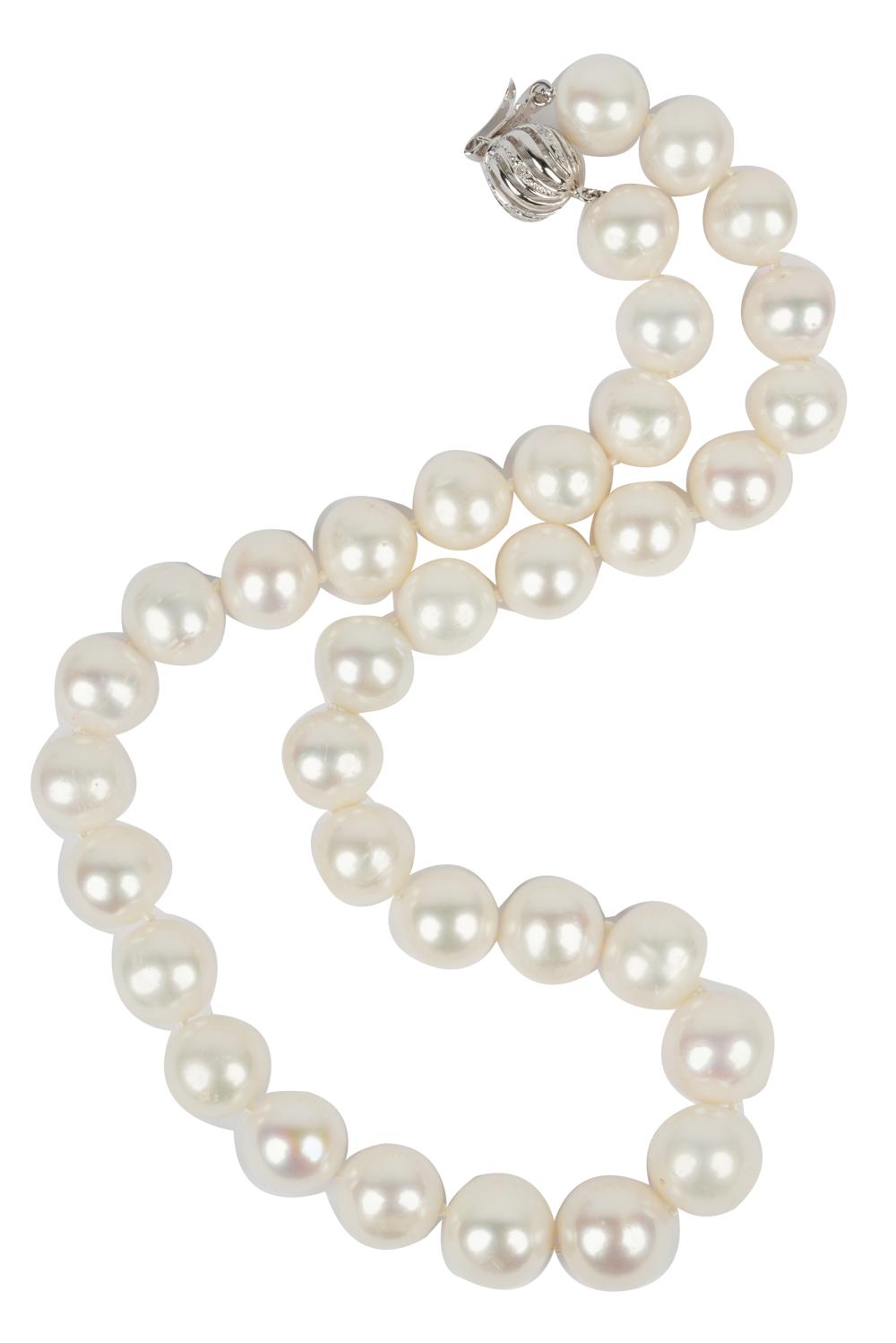 Appraisal: KARAT WHITE GOLD DIAMOND GRADUATED PEARL NECKLACEcontaining semi-round white cultured