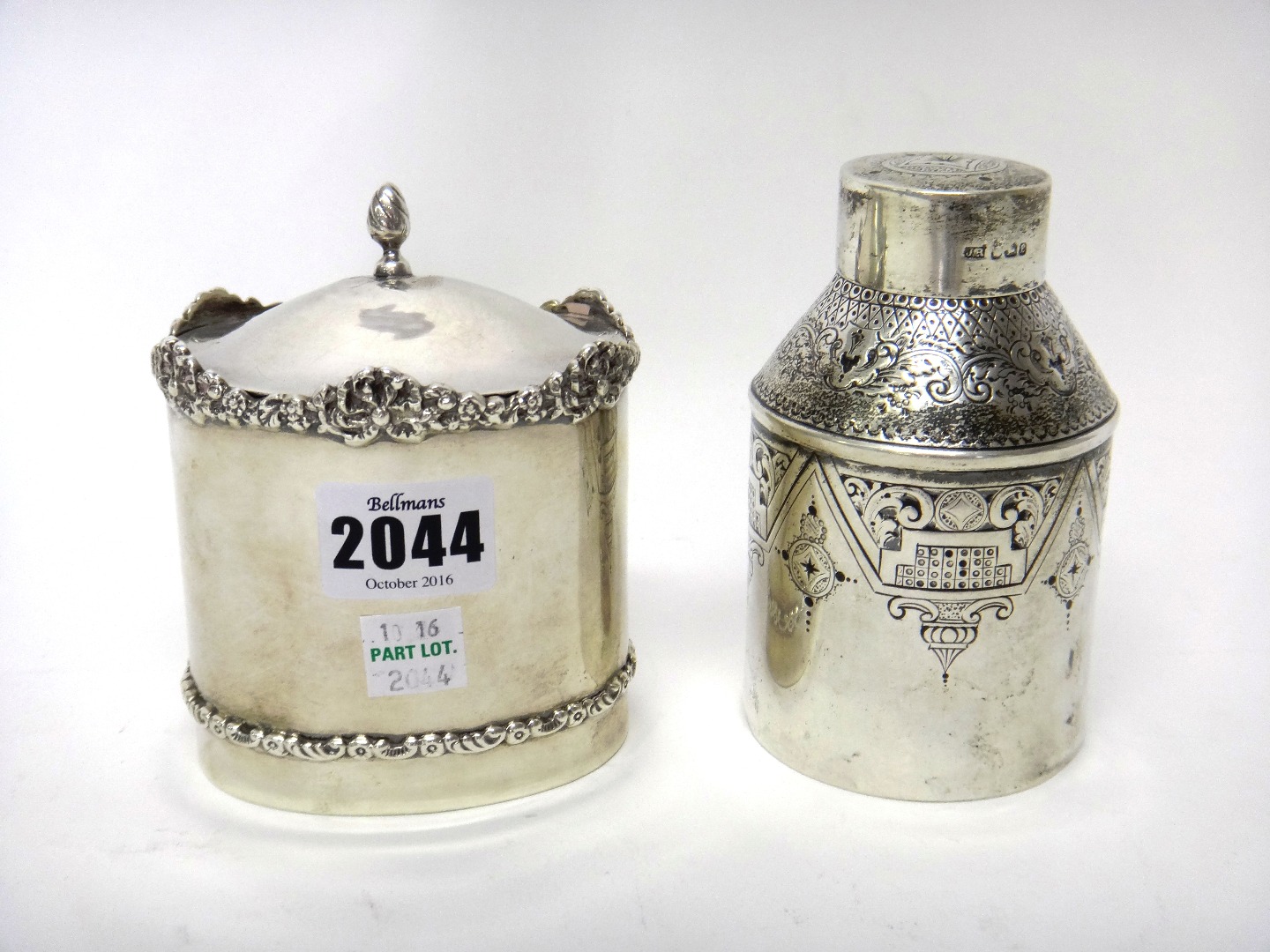 Appraisal: A silver oval hinge lidded tea caddy decorated with a