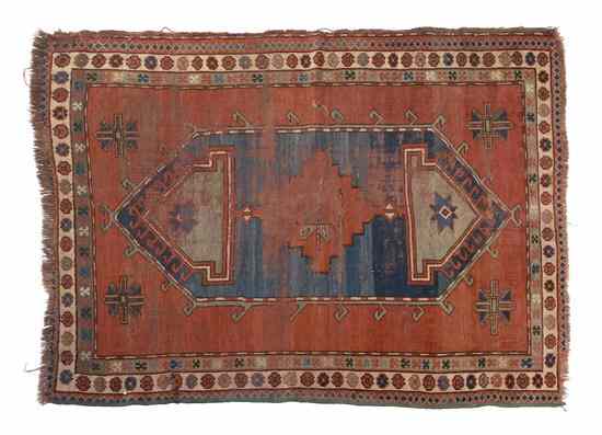 Appraisal: A Northwest Persian Wool Rug having a single geometric medallion