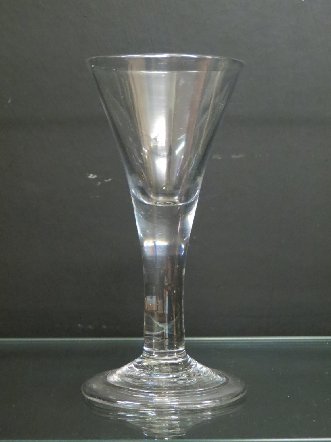 Appraisal: An th century English wine glass drawn-trumpet form conical folded