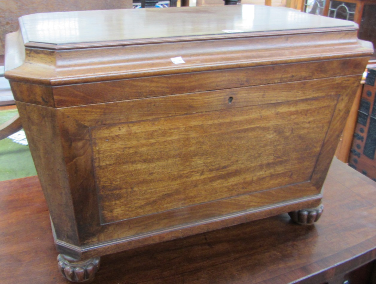 Appraisal: A William IV mahogany sarcophagus shaped cellarette on reeded supports