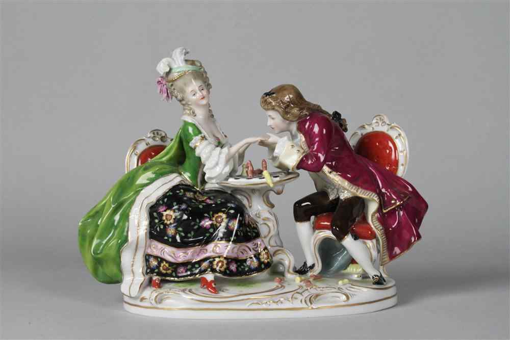 Appraisal: CONTINENTAL PORCELAIN FIGURE GROUP unidentified mark modeled as a fashionable