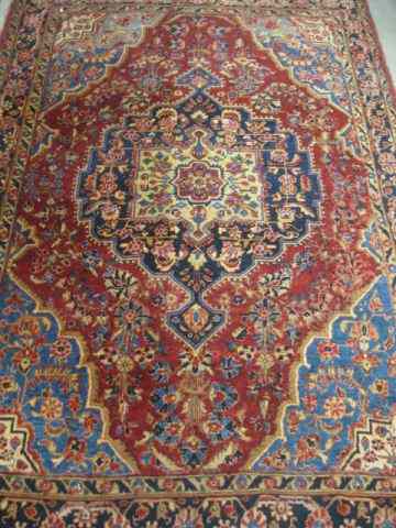 Appraisal: Sarouk Persian Handmade Rug antique rich florals primarily ivory reds