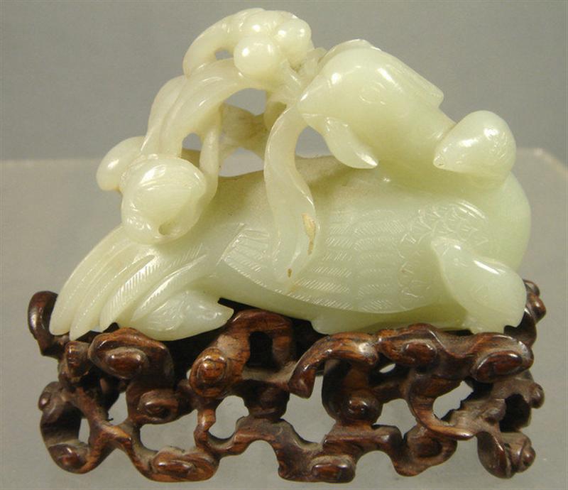 Appraisal: th c Chinese carved jade bird ornament has carved wooden