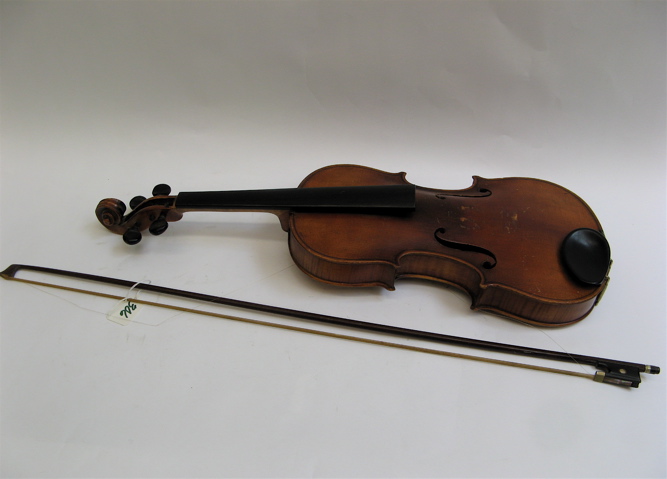 Appraisal: A GERMAN VIOLIN with pegboard cover attached the interior printed