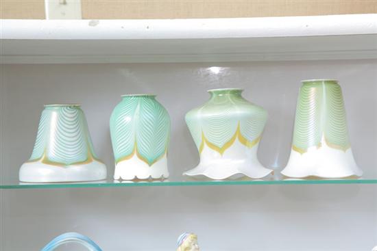 Appraisal: FOUR ART GLASS SHADES All with gold and green pulled