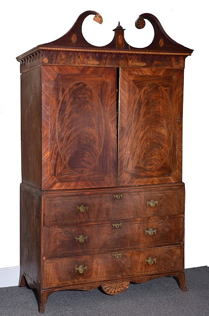 Appraisal: A GEORGE III MAHOGANY LINEN PRESS with satinwood and hairwood