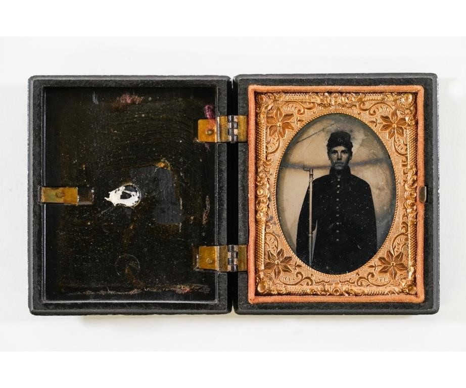 Appraisal: Ambrotype of a Union Civil War soldier holding a musket