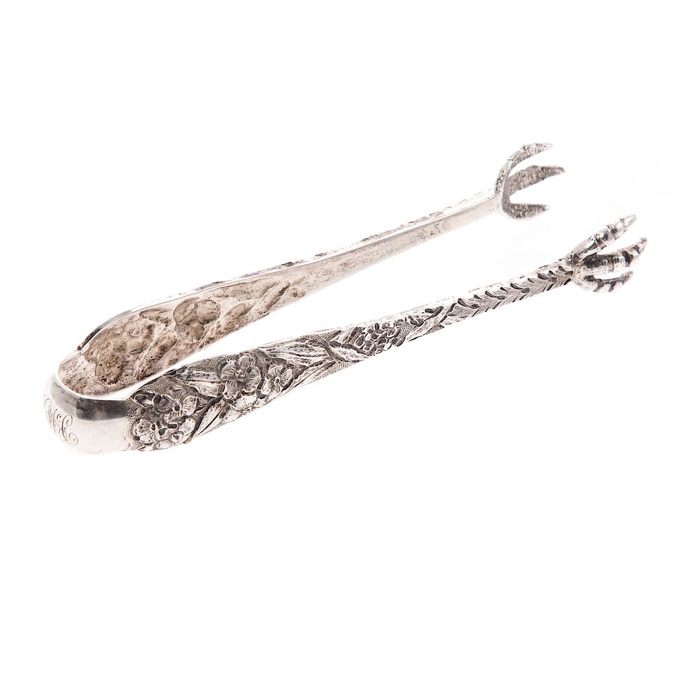 Appraisal: Kirk repousse coin silver ice tongs mid th century hand