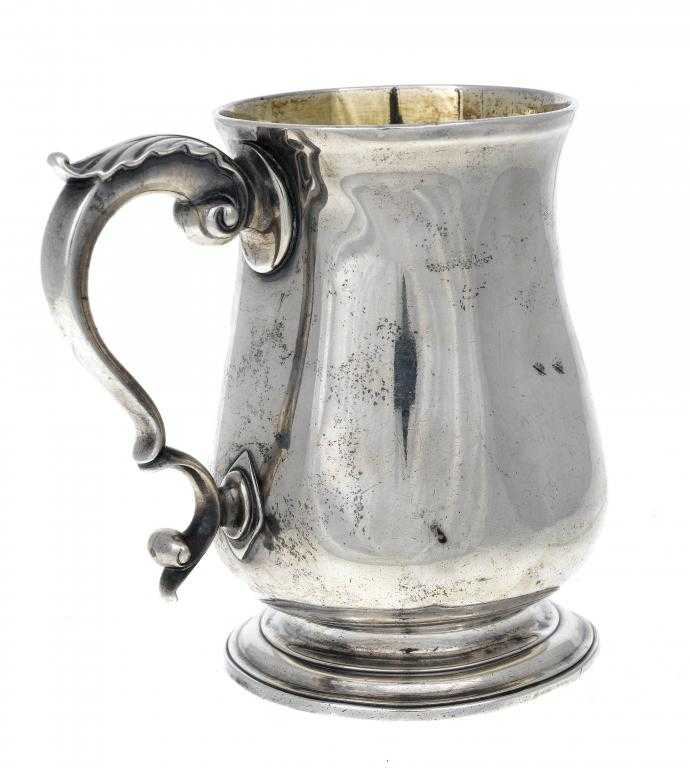 Appraisal: A GEORGE III MUG of baluster form with leaf capped