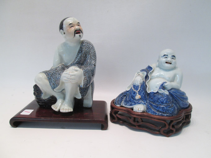 Appraisal: TWO CHINESE PORCELAIN FIGURAL SCULPTURES on wood plinths each with