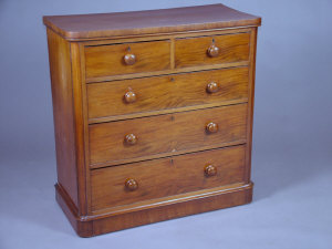 Appraisal: A Victorian mahogany round corner chest of drawers having an