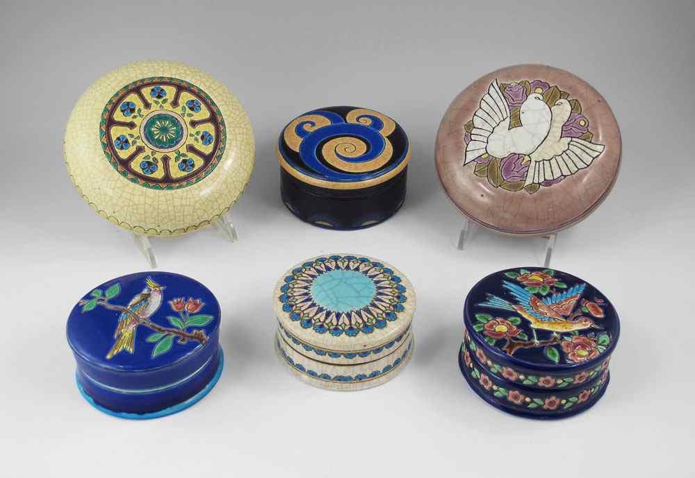 Appraisal: GROUP OF LONGWY FRENCH POTTERY COVERED BOXES French Faience circular