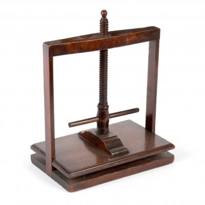 Appraisal: A small th Century mahogany napkin press cm wide