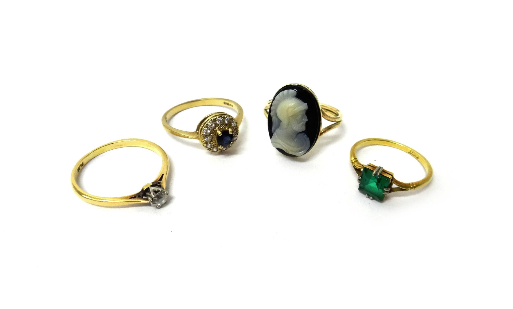 Appraisal: A gold ring mounted with an oval banded agate cameo