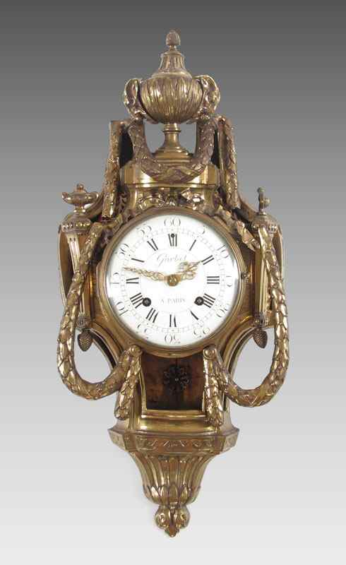 Appraisal: FRENCH GARBET GILT METAL CARTEL CLOCK Circa late th to