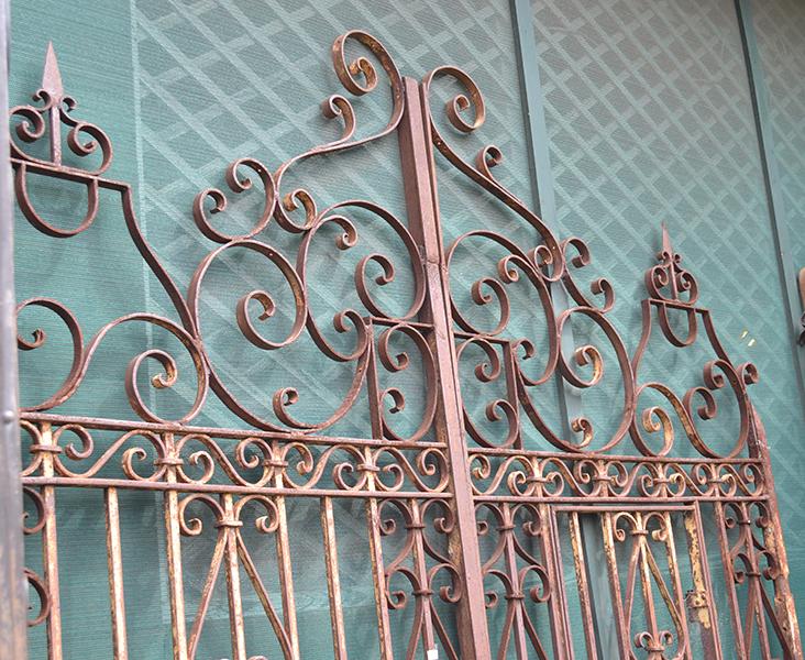 Appraisal: A PAIR OF WROUGHT IRON GATES each with scroll and