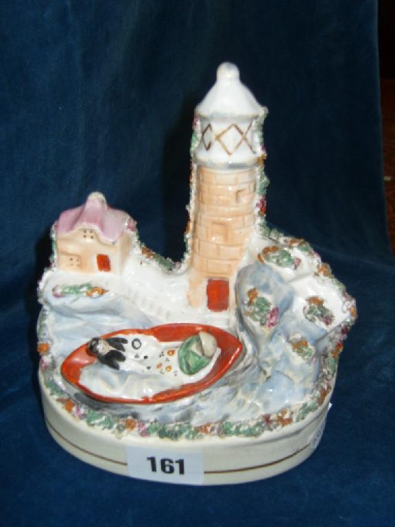 Appraisal: A th century Staffordshire figure group probably showing Grace Darling