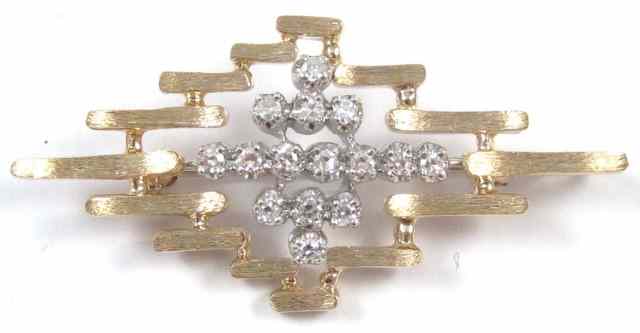 Appraisal: DIAMOND AND FOURTEEN KARAT GOLD BROOCH set with round-cut diamonds