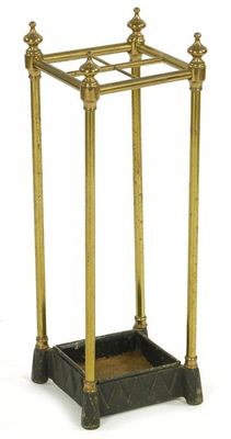 Appraisal: A turned brass and cast iron four division stick stand