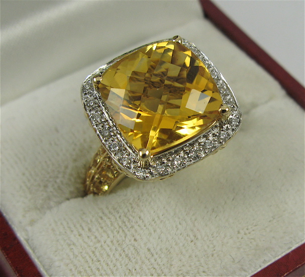 Appraisal: CITRINE DIAMOND AND K GOLD RING centering a checkerboard-cut citrine