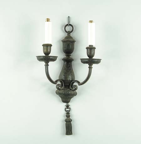 Appraisal: DECORATIVE BRONZE WALL SCONCE Two arm sconce has decorative incised