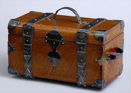 Appraisal: EDWARDIAN OAK TRAVEL CHEST WITH SILVER-PLATED MOUNTS Of travel trunk-form