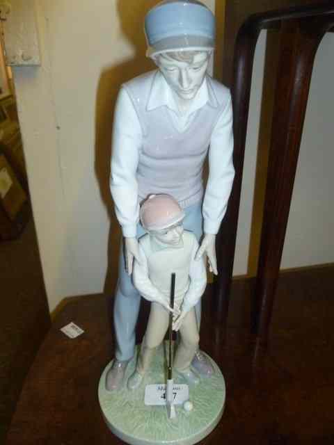 Appraisal: A LLADRO GROUP OF A GOLFER and his son putting