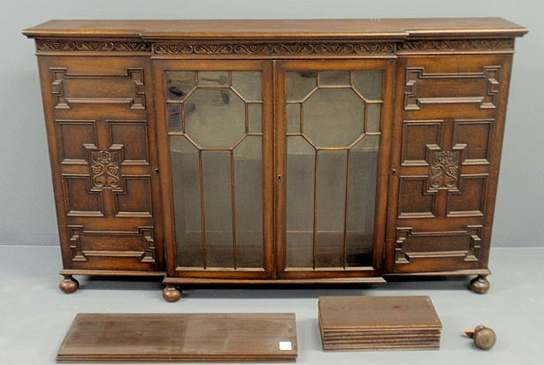 Appraisal: Edwardian style oak bookcase with two glass doors flanked by