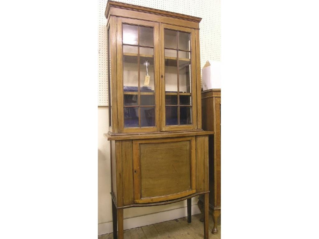 Appraisal: An Edwardian inlaid mahogany display cabinet pair of astragal-glazed doors