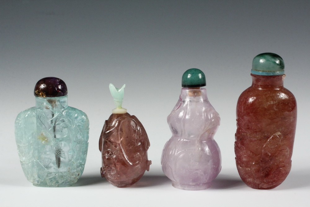 Appraisal: A GROUP OF CARVED STONE SNUFF BOTTLES - Including A