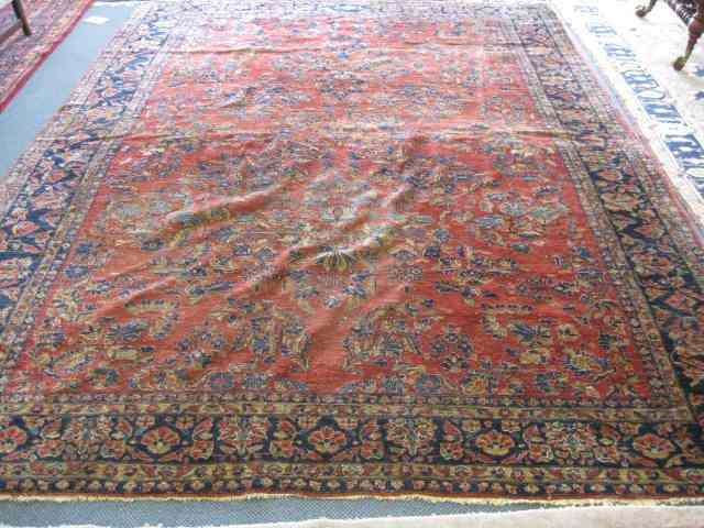 Appraisal: Sarouk Persian Handmade Room Size Rug semi-antique floral red field