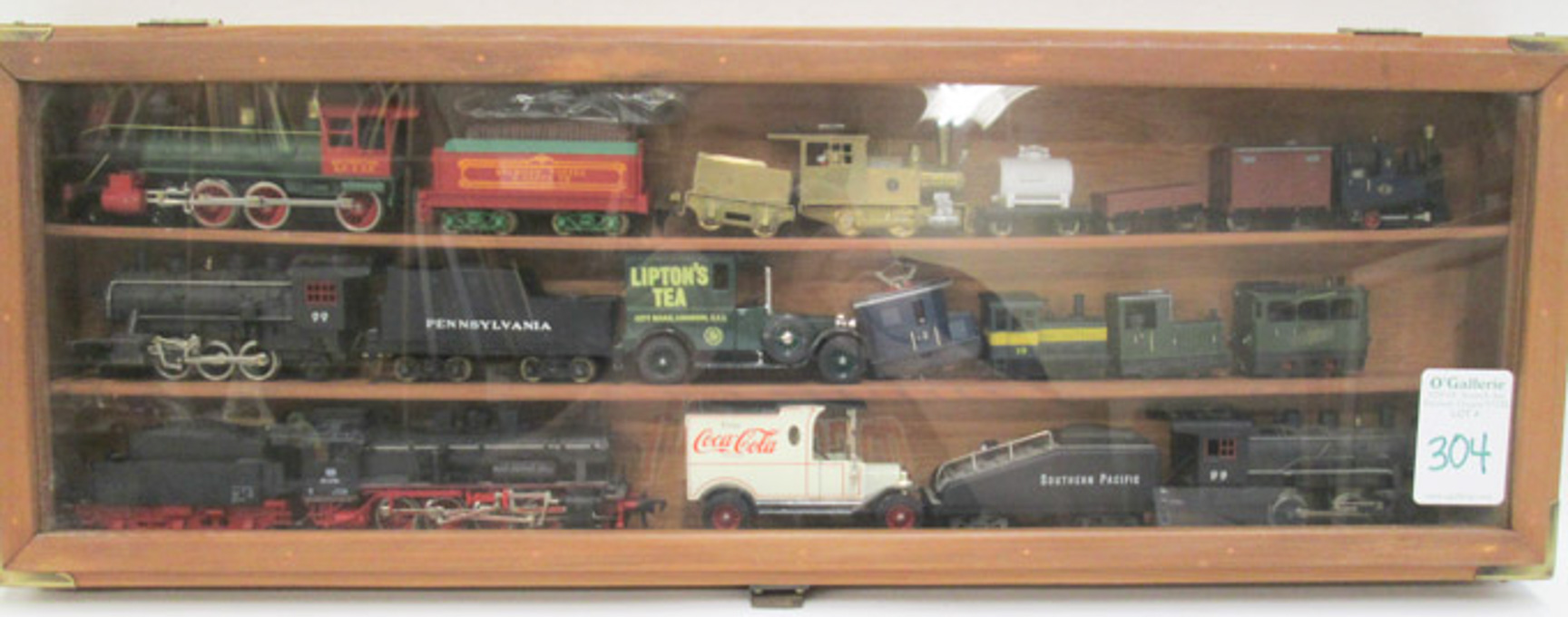 Appraisal: COLLECTIBLE DISPLAY OF TOY TRAINS AND CARS five HO gauge