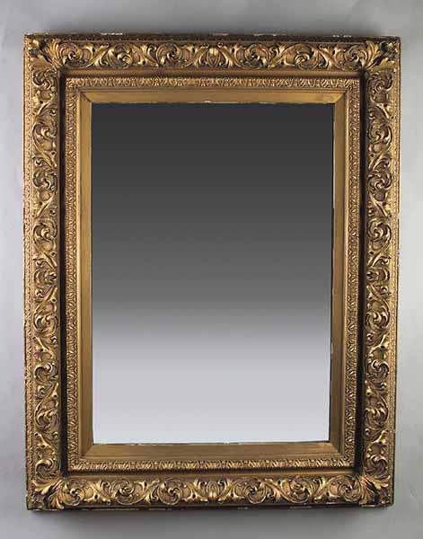 Appraisal: A Carved and Giltwood Looking Glass the molded rectangular frame