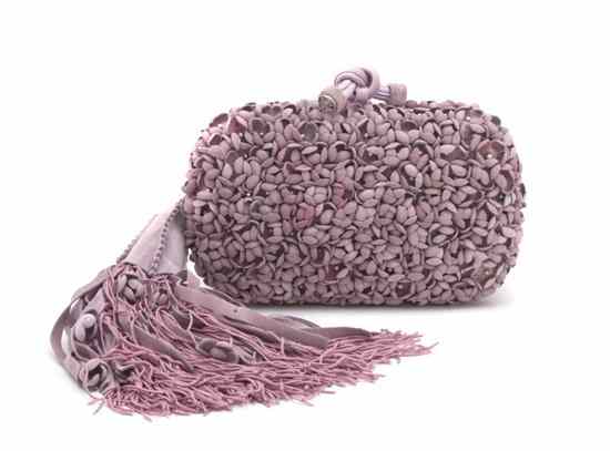 Appraisal: A Bottega Veneta Lavender Suede Hardsided Clutch with flower detail