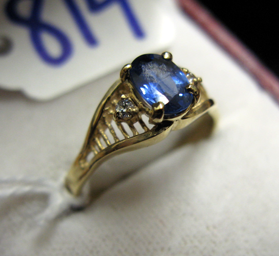 Appraisal: SAPPHIRE DIAMOND AND FOURTEEN KARAT GOLD RING centered and prong