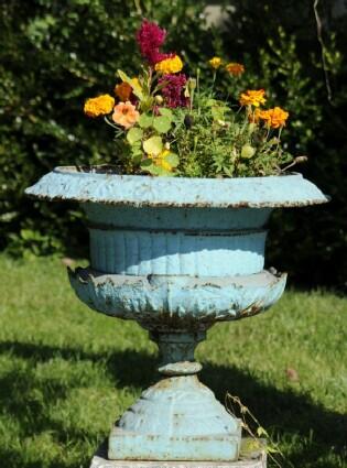 Appraisal: VICTORIAN PAINTED CAST-IRON GARDEN URN Of campagna form decorated with