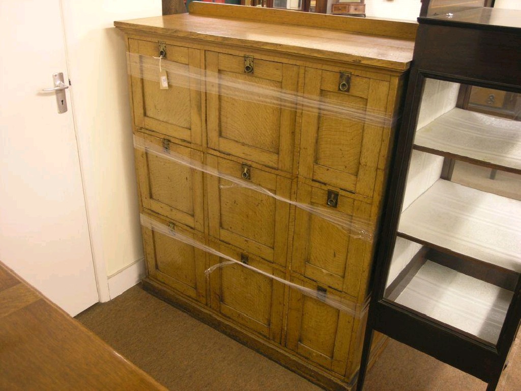 Appraisal: A late Victorian solid light oak filing cabinet enclosed by