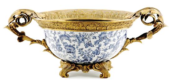 Appraisal: Continental gilt-bronze mounted porcelain centerbowl scrolling acanthus handles rim and