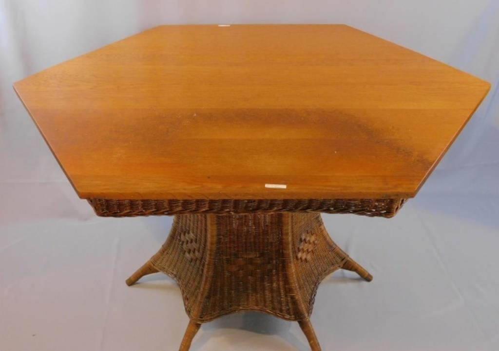 Appraisal: Hexagonal shaped oak top with wicker skirt Natural finish Hexagonal