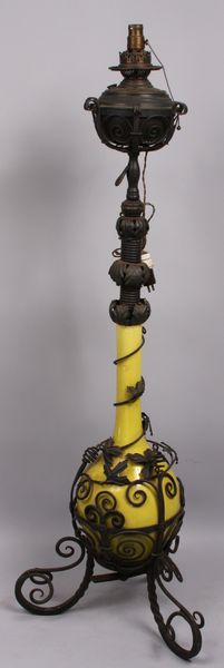 Appraisal: Wrought iron and pottery oil lamp adjustable height from to