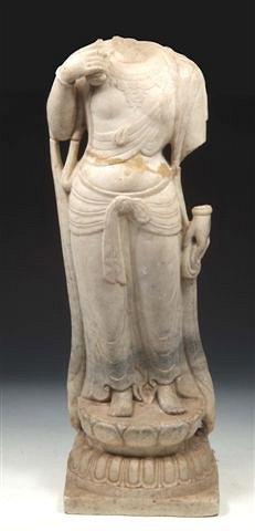 Appraisal: AN INDIAN CARVED MARBLE STANDING DEITY with right arm holding